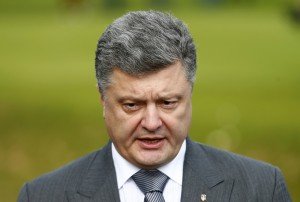 Ukraine's President Petro Poroshenko speaks to the media on the second and final day of the NATO summit at the Celtic Manor resort, near Newport, in Wales September 5, 2014. Poroshenko confirmed that envoys meeting in Minsk to end fighting between Kiev's forces and pro-Russian separatists had signed a ceasefire agreement that would come into effect later on Friday. REUTERS/Andrew Winning (BRITAIN - Tags: MILITARY POLITICS)