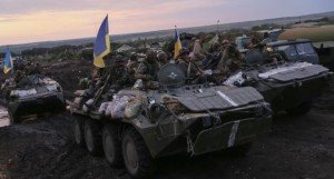 Ukrainian troops are seen near Slaviansk July 8, 2014. Ukraine's government kept up military pressure against pro-Russian rebels on Tuesday, threatening them with an "nasty surprise", while the militants said they were preparing to fight back after losing their main stronghold. REUTERS/Gleb Garanich (UKRAINE - Tags: POLITICS CIVIL UNREST MILITARY)
