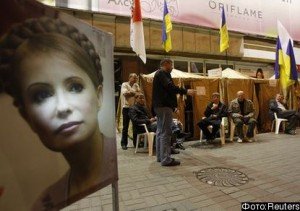 Supporters of former Ukrainian Prime Minister Yulia Tymoshenko sit in a tent camp outside the Pecherskiy District Court in Kiev