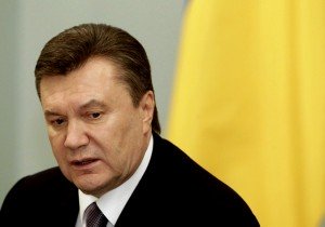 Ukraine's President Yanukovich looks on during a meeting with Russia's Prime Minister Putin in Moscow