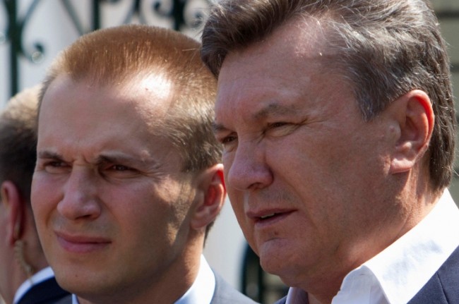Ukrainian President Viktor Yanukovich (R) is pictured with his son Oleksander in April 2010. On a street in ousted President Yanukovich's political stronghold, Donetsk, stands the imposing headquarters of the Mako Group, a Ukrainian banking-to-construction conglomerate. The 20-storey block is modern but built in the decorated style of the Stalin era and contains a hotel, restaurant, bank, and Mako's unmarked offices - all, according to residents, belonging to Yanukovich's eldest son Oleksander, 40. Picture taken April 2010. To match UKRAINE-CRISIS/MAKO REUTERS/Stringer (UKRAINE - Tags: POLITICS BUSINESS)
