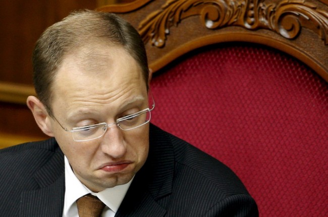 epa01514394 Speaker of Ukrainian Parliament Arseniy Yatsenyuk grimaces during a parliament session in Kiev, 09 October 2008. Ukrainian President Viktor Yushchenko dissolved parliament in a speech broadcast late 08 October and called for fresh elections. Following the collapse of the pro-Western coalition of Yushchenko?s party and Prime Minister Yulia Tymoshenko?s bloc, it is hoped that fresh elections will offer a way out of the current political impasse. EPA/SERGEY DOLZHENKO