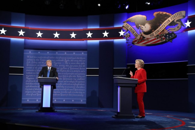 epa05557673 Republican Donald Trump (L) and Democrat Hillary Clinton (R) debate during the first Presidential Debate at Hofstra University in Hempstead, New York, USA, 26 September 2016. The only Vice Presidential debate will be held on 04 October in Virginia, and the second and third Presidential Debates will be held on 09 October in Missouri and 19 October in Nevada.  EPA/ANDREW GOMBERT