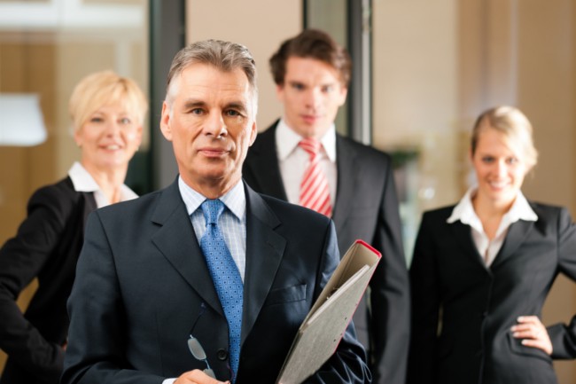 Business Team with leader in office